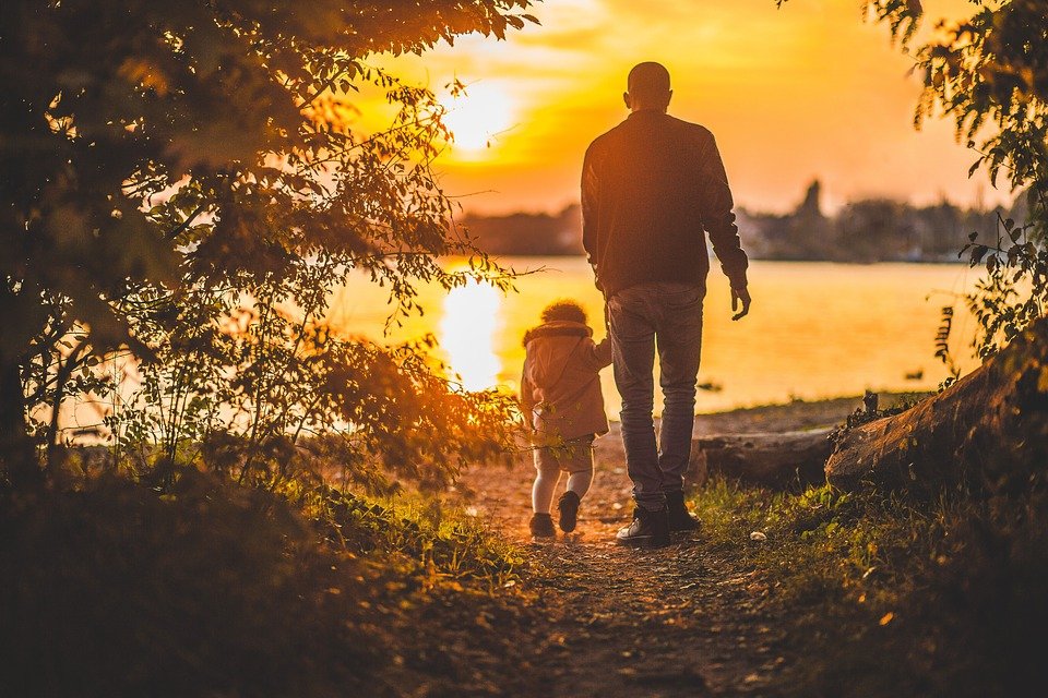 Dad hiking with child