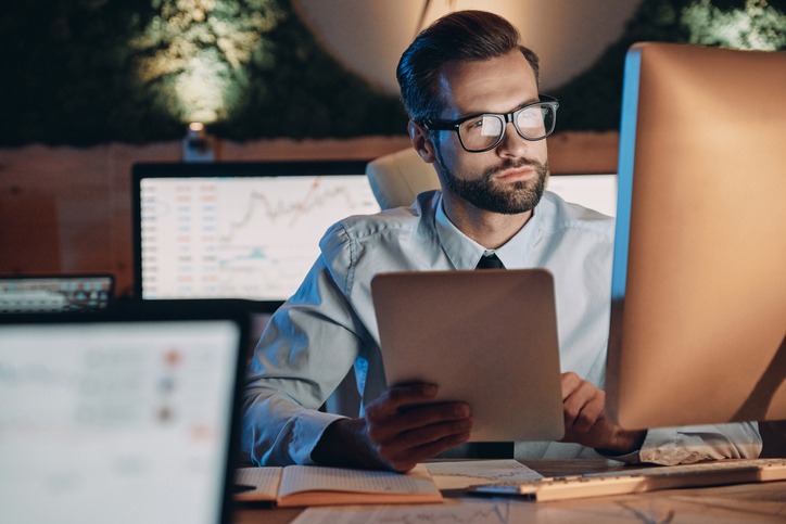 Confident young man working on computer