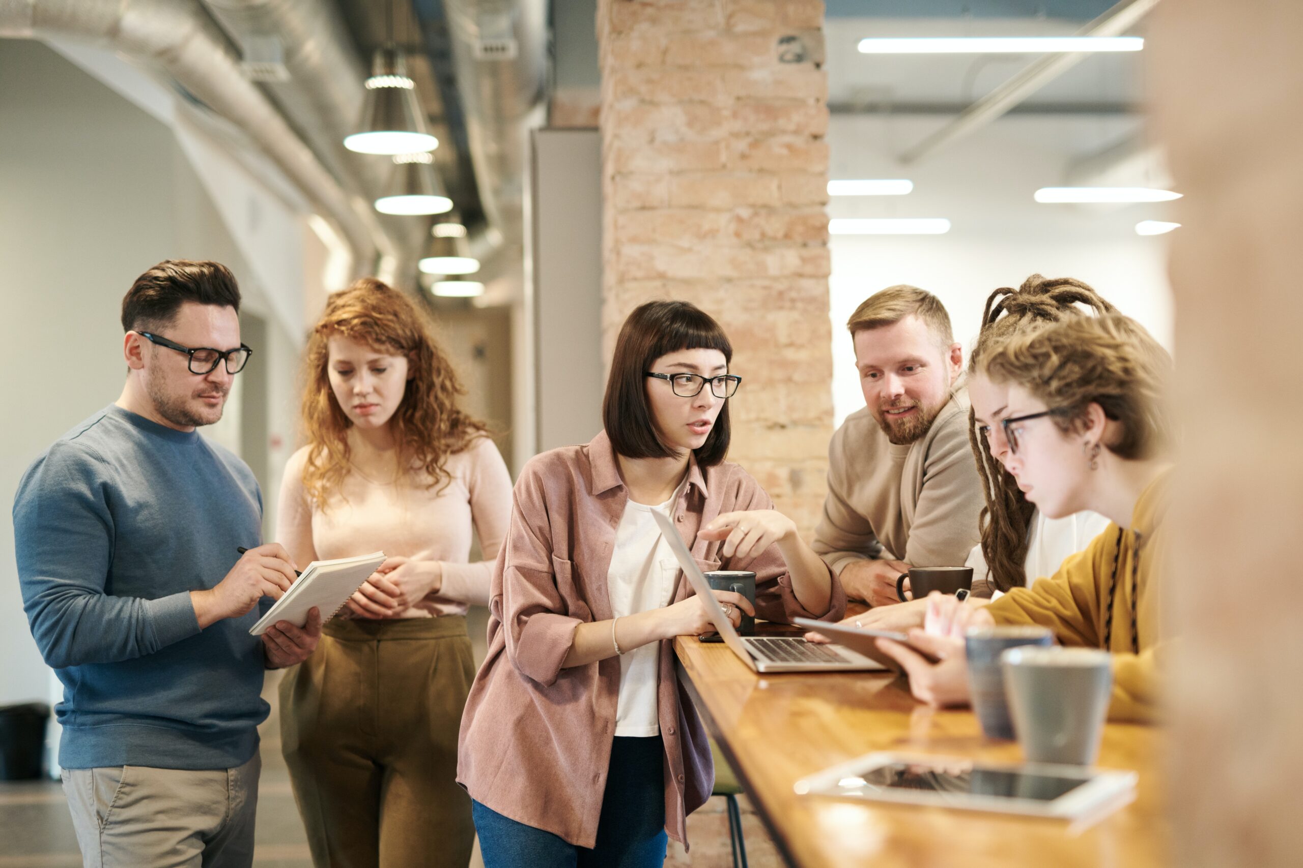 shallow-focus-photo-of-people-discussing